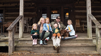 A family with 4 kids wearing Mossy Oak kids' apparel