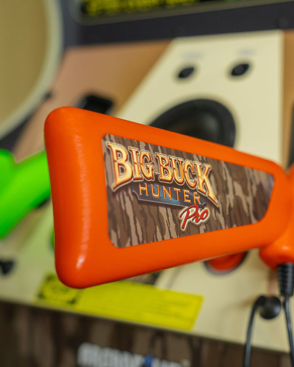A close up of the butt of Big Buck Hunter Arcade game's rifle featuring branded sticker